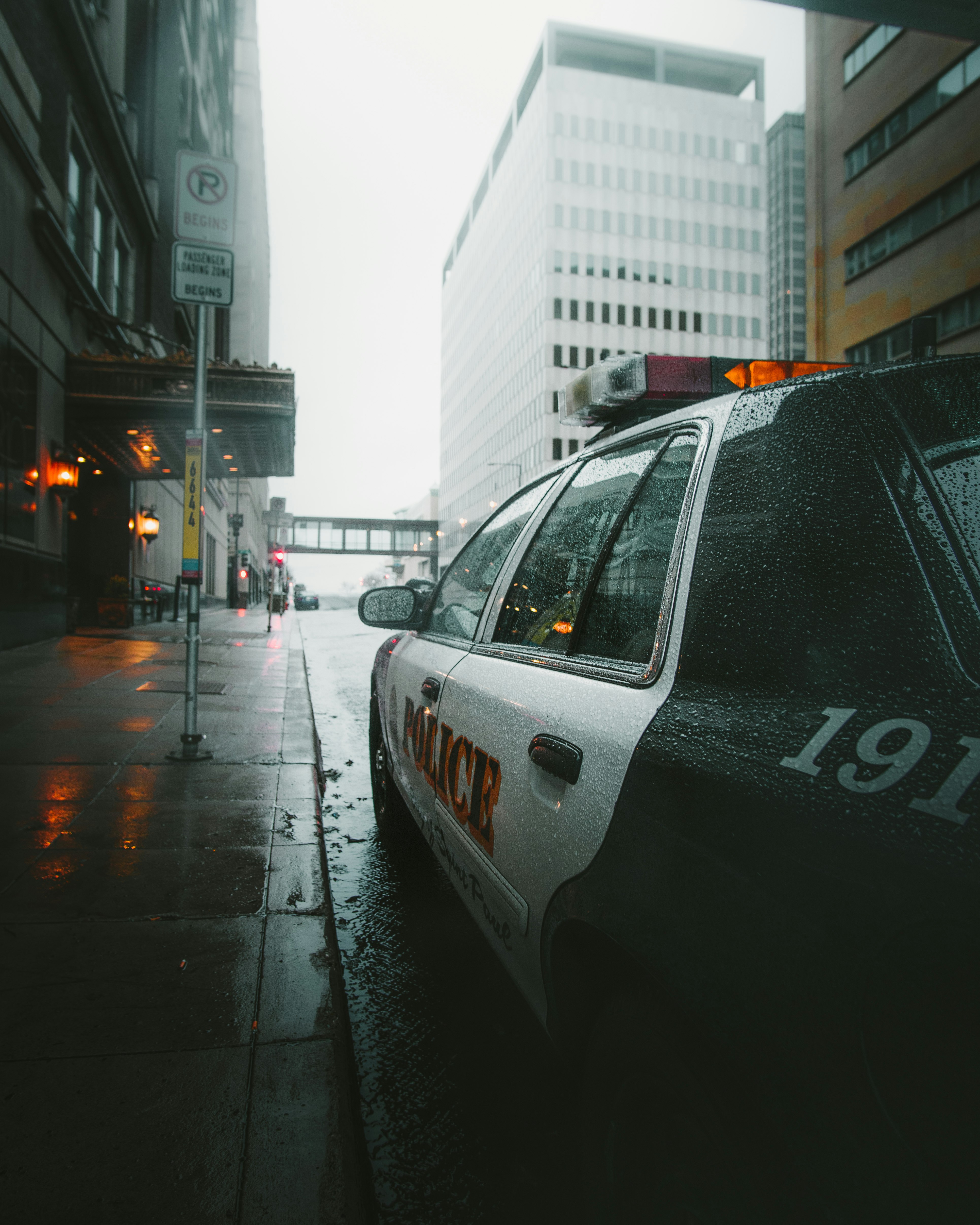 white and black police car on road